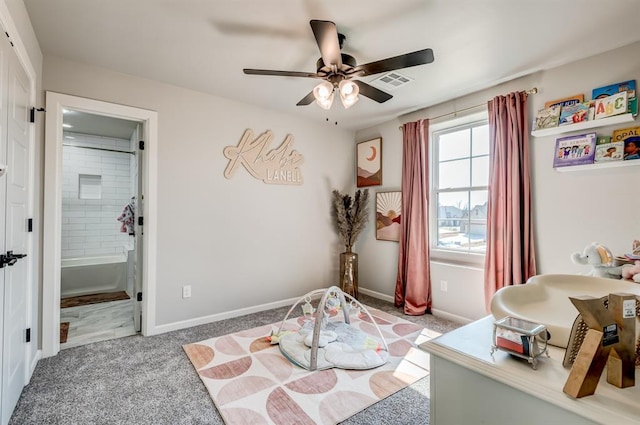 1219 N Adair Ct, Stillwater, OK 74075 - carpeted bedroom featuring visible vents, baseboards, connected bathroom, and ceiling fan