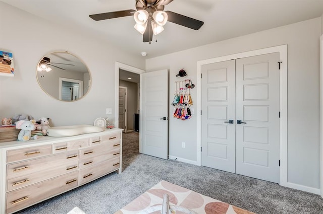 1219 N Adair Ct, Stillwater, OK 74075 - bedroom with light carpet, a closet, baseboards, and ceiling fan