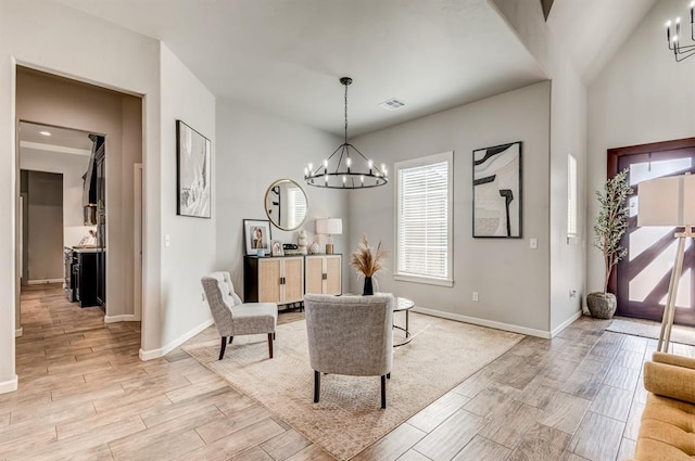 1219 N Adair Ct, Stillwater, OK 74075 - interior space featuring visible vents, baseboards, a chandelier, and wood tiled floor