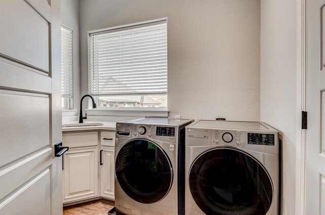 1219 N Adair Ct, Stillwater, OK 74075 - laundry room with separate washer and dryer, a sink, and cabinet space