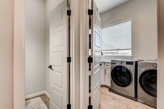 1219 N Adair Ct, Stillwater, OK 74075 - clothes washing area with light wood-style floors, separate washer and dryer, and baseboards