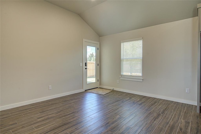 4980 12th Ave, Goldsby, OK 73093 - empty room with dark wood-style flooring, vaulted ceiling, and baseboards