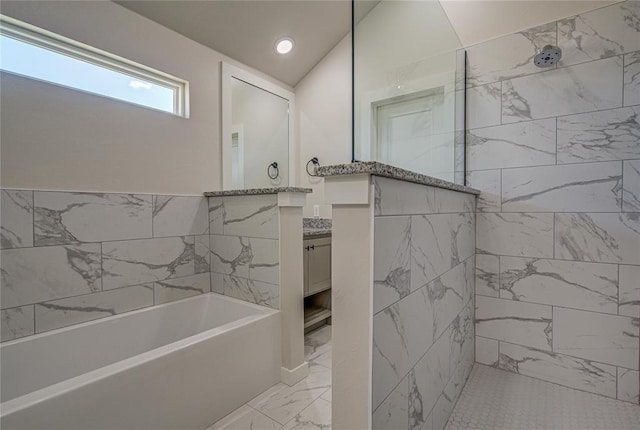 4980 12th Ave, Goldsby, OK 73093 - bathroom featuring marble finish flooring, vanity, a garden tub, walk in shower, and recessed lighting