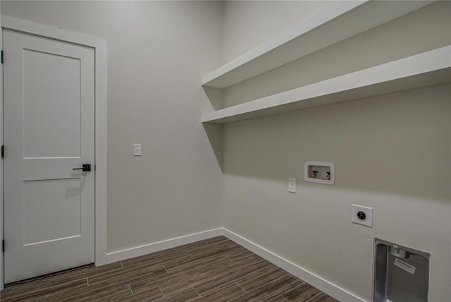 4980 12th Ave, Goldsby, OK 73093 - laundry room with hookup for an electric dryer, washer hookup, baseboards, and dark wood-type flooring