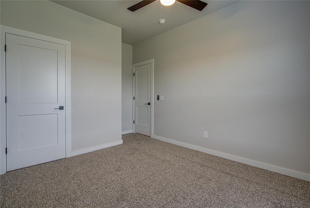 4980 12th Ave, Goldsby, OK 73093 - unfurnished bedroom with light colored carpet, baseboards, and ceiling fan