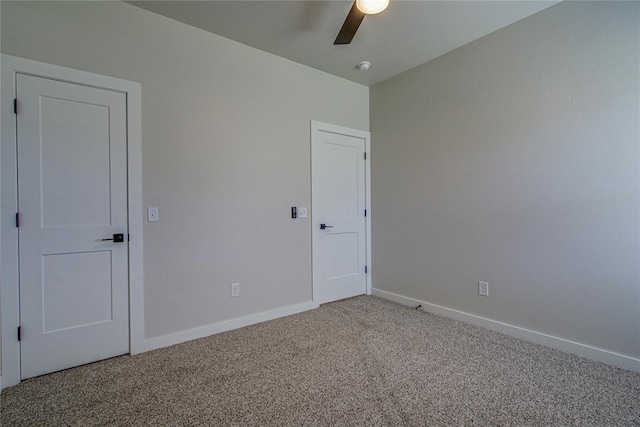 4980 12th Ave, Goldsby, OK 73093 - unfurnished bedroom with light carpet, baseboards, and a ceiling fan