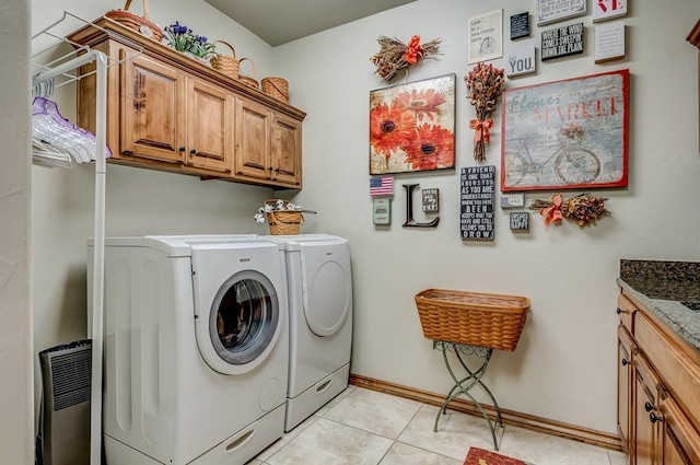 3615 S Scissortail Dr, Stillwater, OK 74074 - laundry area with separate washer and dryer, baseboards, light tile patterned flooring, and cabinet space