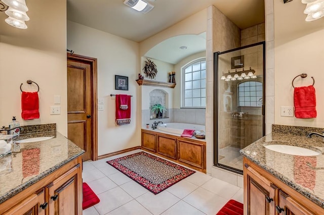 3615 S Scissortail Dr, Stillwater, OK 74074 - full bath with a stall shower, two vanities, and a sink