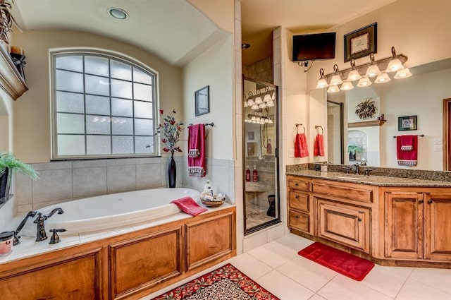 3615 S Scissortail Dr, Stillwater, OK 74074 - full bath with vanity, a stall shower, tile patterned flooring, and a garden tub