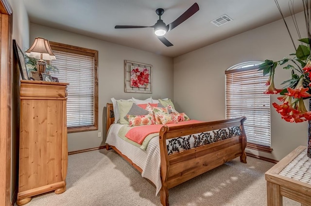 3615 S Scissortail Dr, Stillwater, OK 74074 - carpeted bedroom with visible vents, baseboards, and a ceiling fan