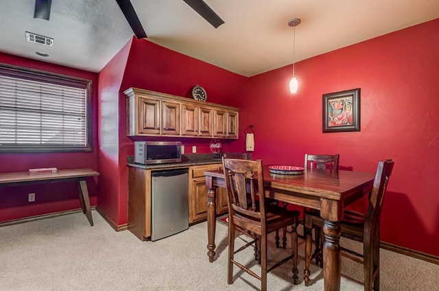 3615 S Scissortail Dr, Stillwater, OK 74074 - dining area with visible vents, baseboards, and light carpet