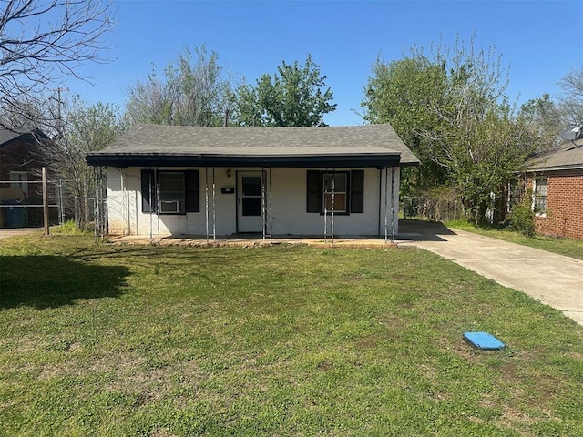 view of front of property with a porch, a front lawn, driveway, and fence
