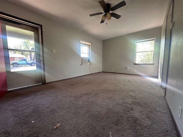 empty room with ceiling fan, carpet floors, a textured wall, and baseboards
