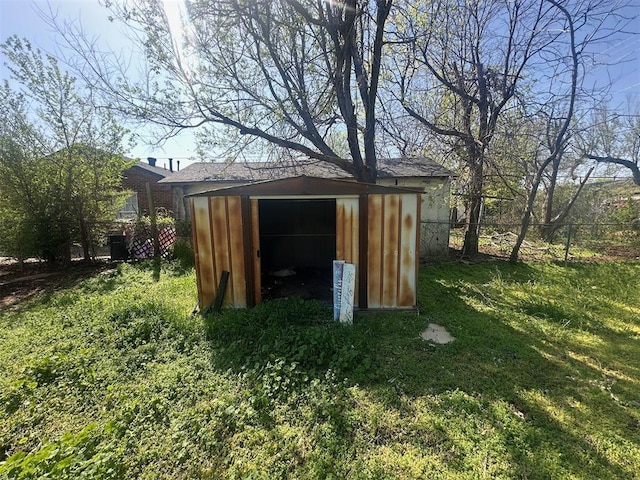 view of shed with fence