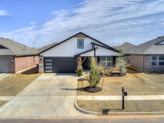 view of front facade with an attached garage and concrete driveway