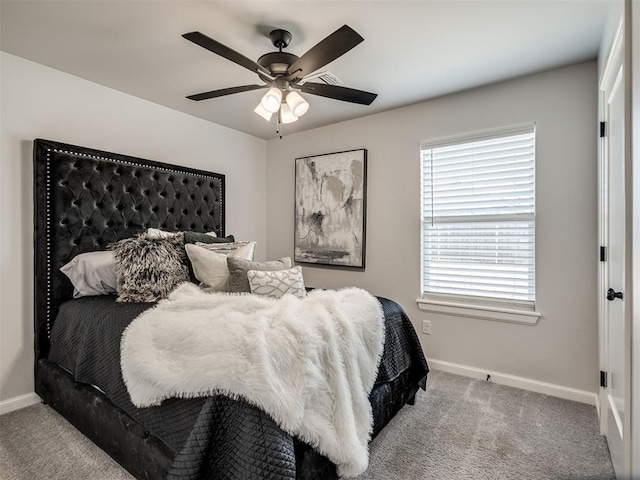 bedroom featuring ceiling fan, baseboards, and carpet floors