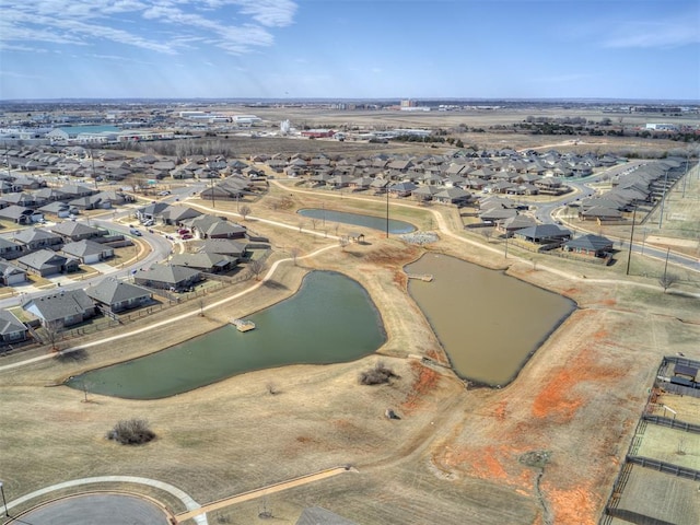 bird's eye view with a water view and a residential view