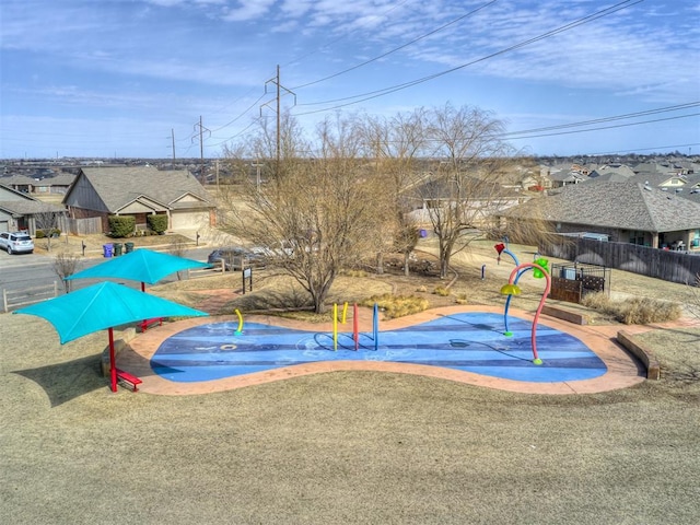 view of swimming pool featuring fence