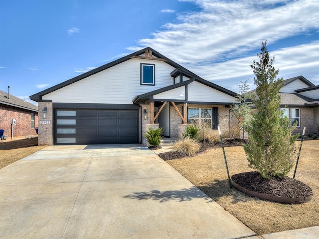 view of front of property featuring brick siding and driveway