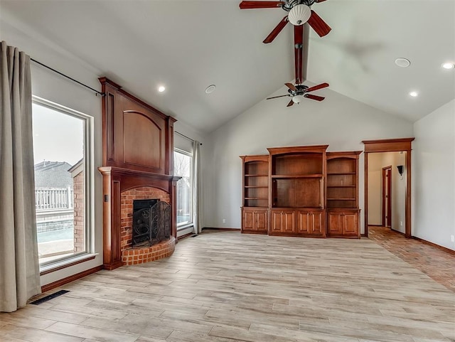 1217 Camelot Dr, Yukon, OK 73099 - unfurnished living room with a ceiling fan, light wood-type flooring, and a healthy amount of sunlight