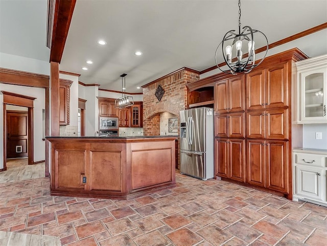 1217 Camelot Dr, Yukon, OK 73099 - kitchen with stainless steel appliances, stone finish floor, a chandelier, and crown molding