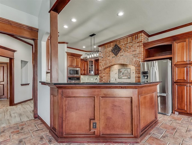 1217 Camelot Dr, Yukon, OK 73099 - kitchen with crown molding, brown cabinetry, glass insert cabinets, appliances with stainless steel finishes, and stone finish floor