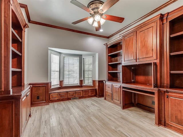 1217 Camelot Dr, Yukon, OK 73099 - unfurnished office with visible vents, a ceiling fan, crown molding, wainscoting, and light wood-style flooring