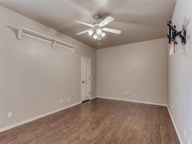 1217 Camelot Dr, Yukon, OK 73099 - spare room with dark wood finished floors, baseboards, and ceiling fan