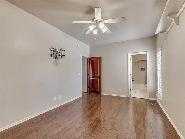 1217 Camelot Dr, Yukon, OK 73099 - unfurnished room featuring baseboards, a ceiling fan, wood finished floors, and visible vents