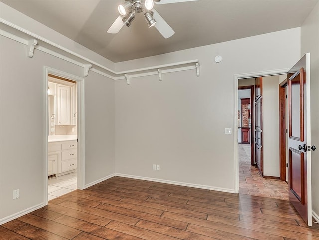 1217 Camelot Dr, Yukon, OK 73099 - unfurnished room featuring light wood-type flooring, a ceiling fan, and baseboards