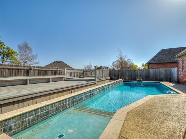 1217 Camelot Dr, Yukon, OK 73099 - view of pool featuring a fenced in pool, a patio, a fenced backyard, and a deck
