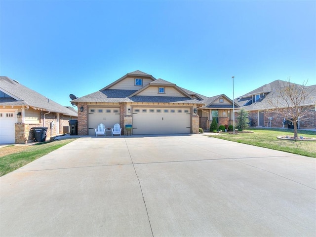 craftsman-style home featuring a garage, brick siding, a front yard, and concrete driveway