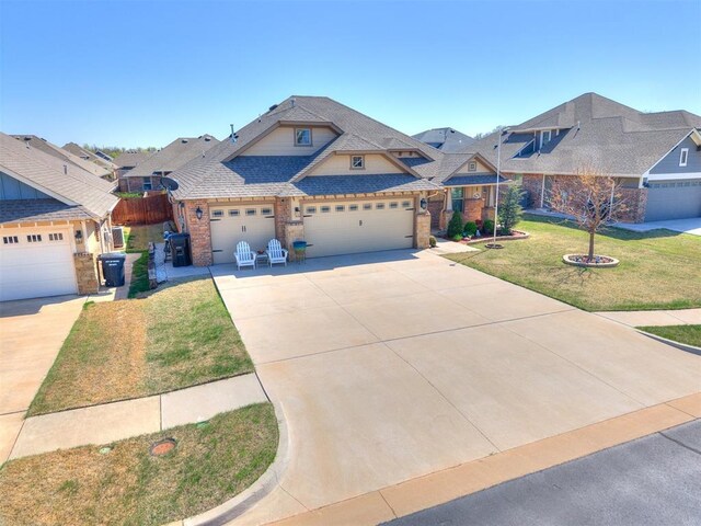 craftsman-style house with a front lawn, brick siding, fence, and driveway