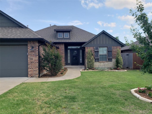 9908 SW 22nd St, Yukon, OK 73099 - view of front facade featuring brick siding, a shingled roof, a garage, and driveway