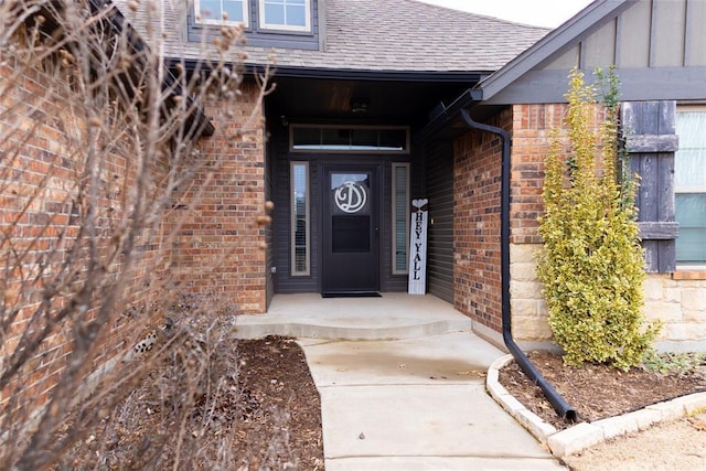 9908 SW 22nd St, Yukon, OK 73099 - doorway to property with brick siding and a shingled roof