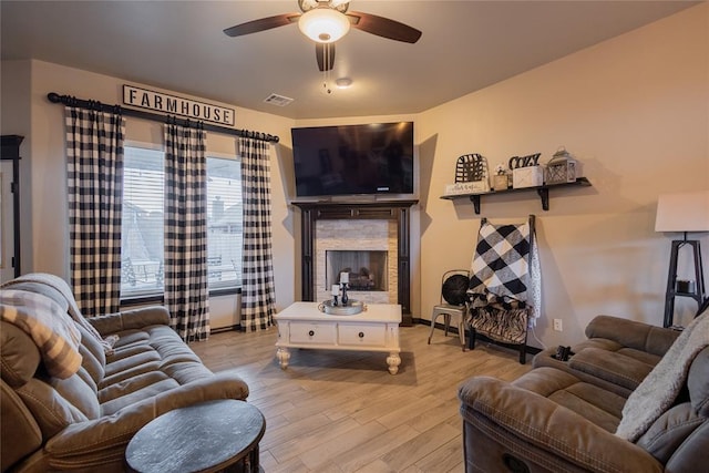 9908 SW 22nd St, Yukon, OK 73099 - living area with ceiling fan, light wood finished floors, and baseboards