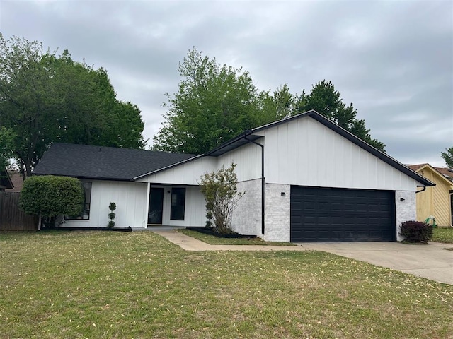10533 Ricky Ln, Midwest City, OK 73130 - view of front of home featuring fence, concrete driveway, a front yard, and a garage