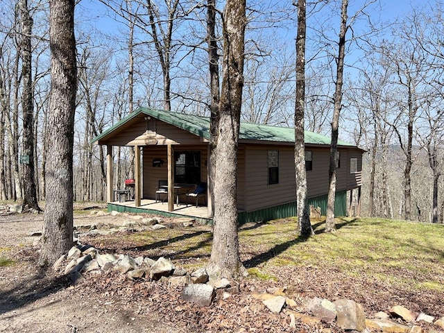 view of front of home with log veneer siding