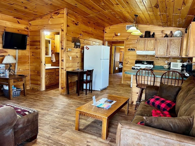 living area with visible vents, light wood-style floors, wood ceiling, wood walls, and lofted ceiling
