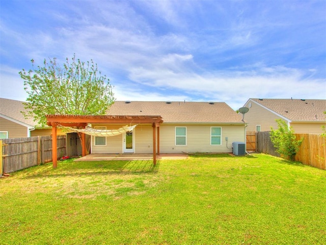 1801 NW 145th St, Edmond, OK 73013 - rear view of house featuring central AC unit, a pergola, a fenced backyard, a patio, and a lawn