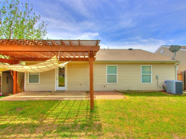 1801 NW 145th St, Edmond, OK 73013 - back of house featuring a pergola, a patio area, a lawn, and central AC