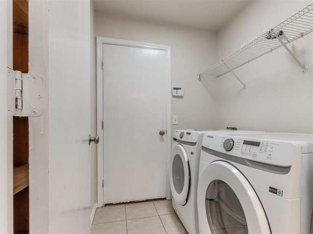 1801 NW 145th St, Edmond, OK 73013 - laundry room with washer and clothes dryer, laundry area, and light tile patterned flooring