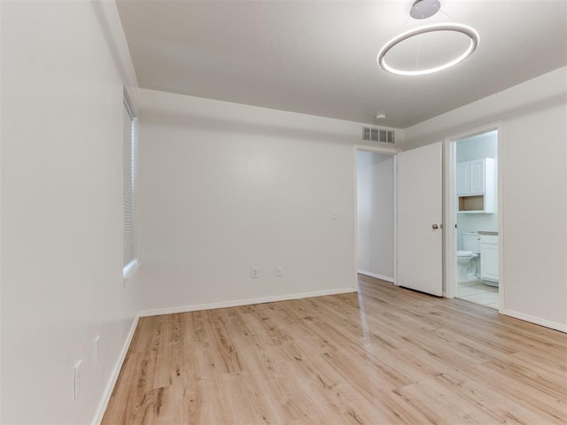 1801 NW 145th St, Edmond, OK 73013 - empty room with wood finished floors, visible vents, and baseboards