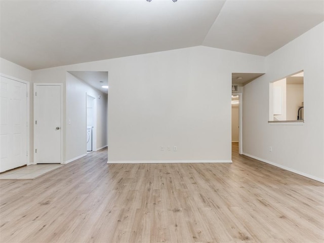 1801 NW 145th St, Edmond, OK 73013 - unfurnished living room featuring baseboards, vaulted ceiling, and wood finished floors