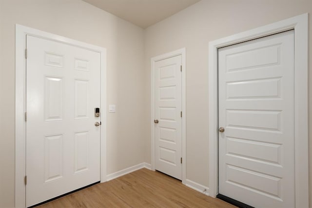 2416 Kathleens Xing, Yukon, OK 73099 - foyer entrance featuring light wood-type flooring and baseboards