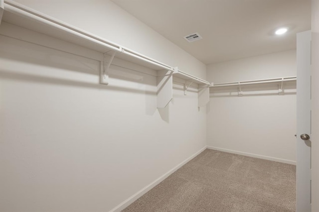 2416 Kathleens Xing, Yukon, OK 73099 - walk in closet featuring carpet