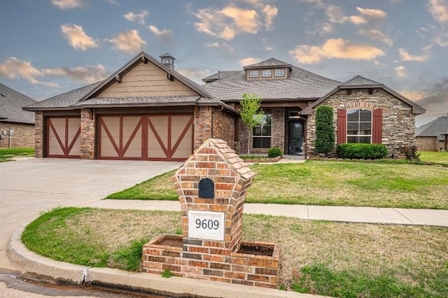 9609 Lakecrest Dr, Oklahoma City, OK 73159 - view of front of property featuring roof with shingles, driveway, an attached garage, a front yard, and brick siding