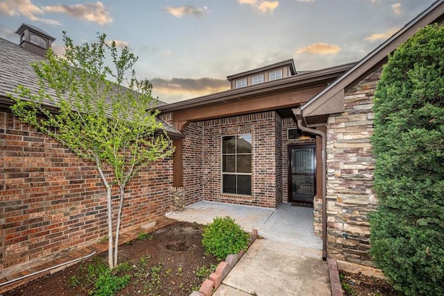 9609 Lakecrest Dr, Oklahoma City, OK 73159 - entrance to property with a patio area and brick siding