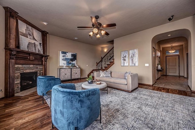 9609 Lakecrest Dr, Oklahoma City, OK 73159 - living room with ceiling fan, arched walkways, wood finished floors, and stairs