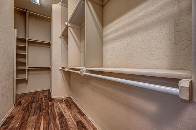 9609 Lakecrest Dr, Oklahoma City, OK 73159 - spacious closet featuring dark wood-style flooring